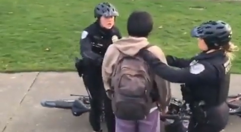 Students Walk With Their Hands Up Past Police Officers Outside North